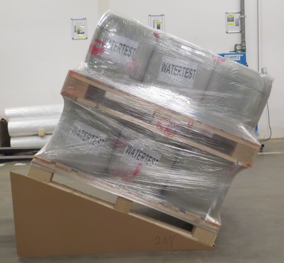 Wrapped pallet on 26-degree tilt test verifying load stability